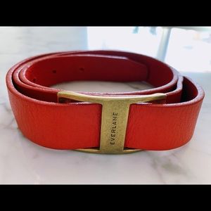 Red genuine leather belt w/ brass buckle. Size S.